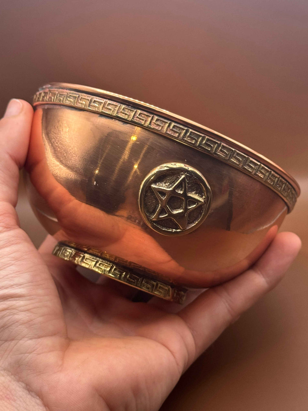 A handcrafted copper Altar Bowl featuring a pentacle symbol, perfect for spiritual rituals and home cleansing.