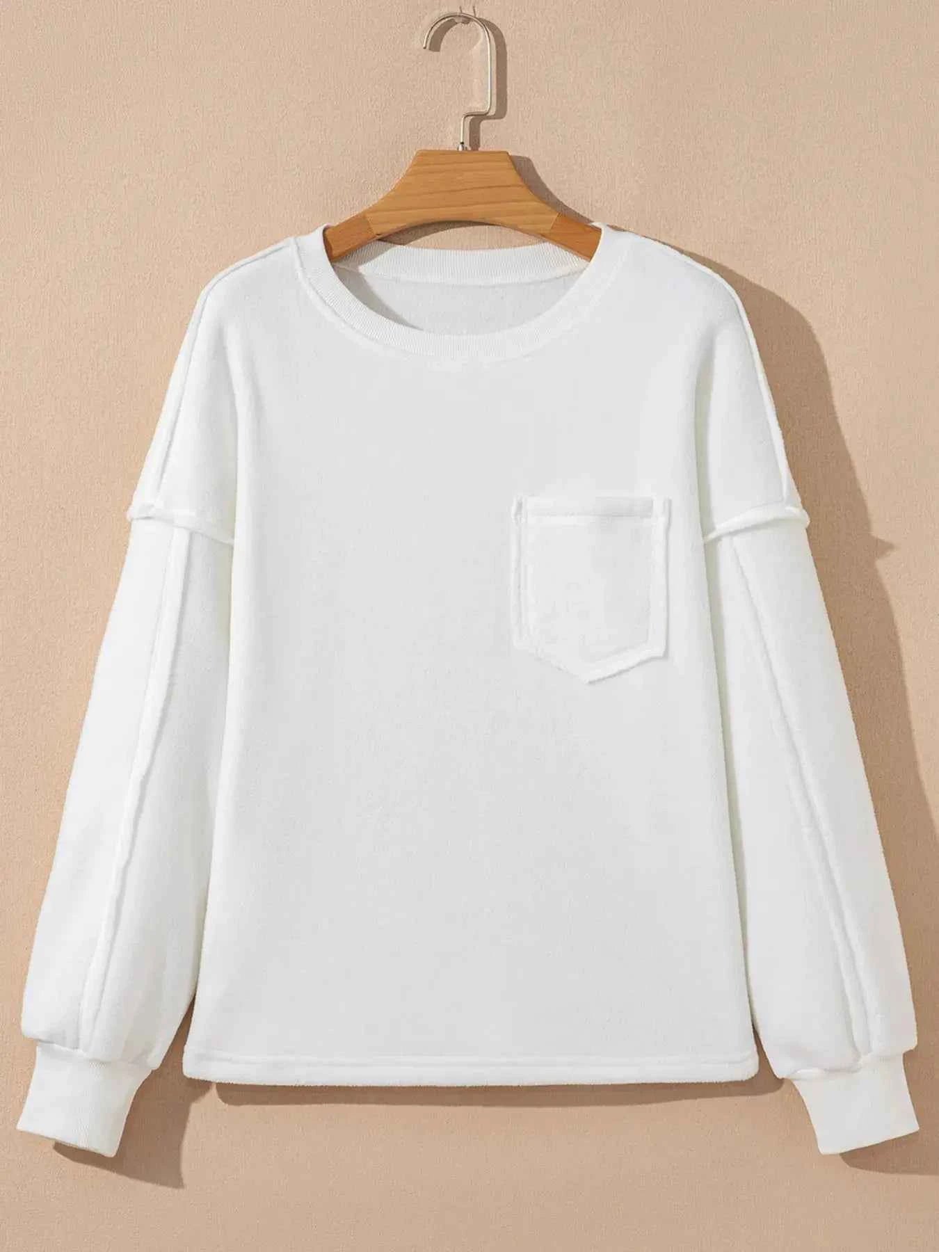Cozy Cream Exposed Seam Knit Pocket Pullover Sweatshirt