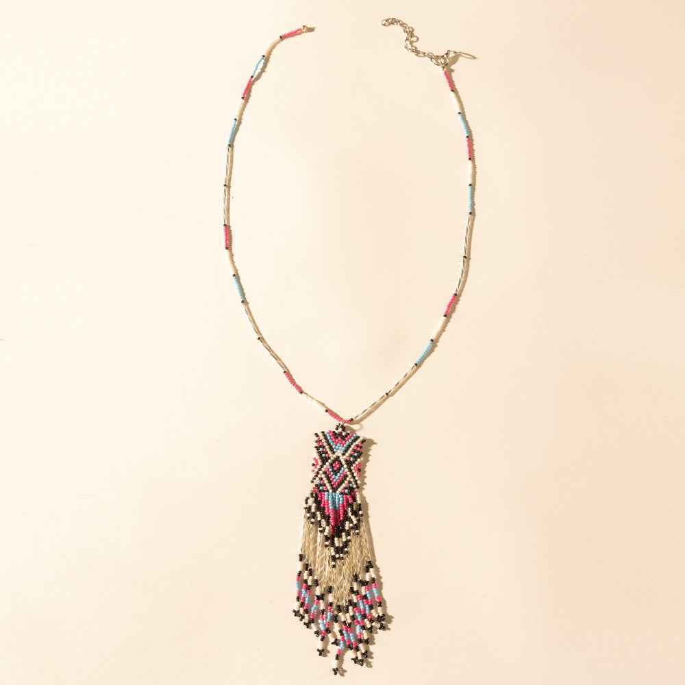 Myra Sky and Coral in necklace in Turquoise