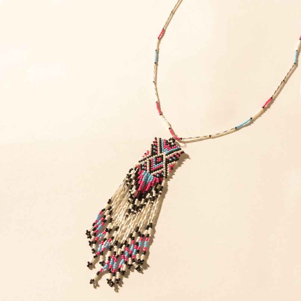 Myra Sky and Coral in necklace in Turquoise