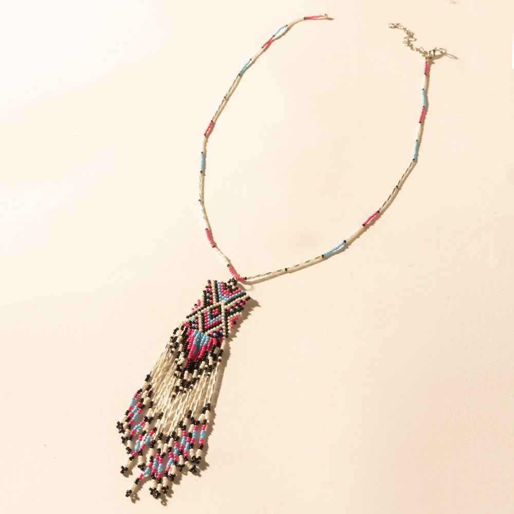 Myra Sky and Coral in necklace in Turquoise